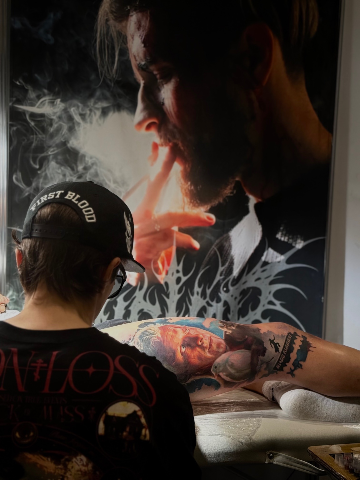 Artist at work on a tattoo