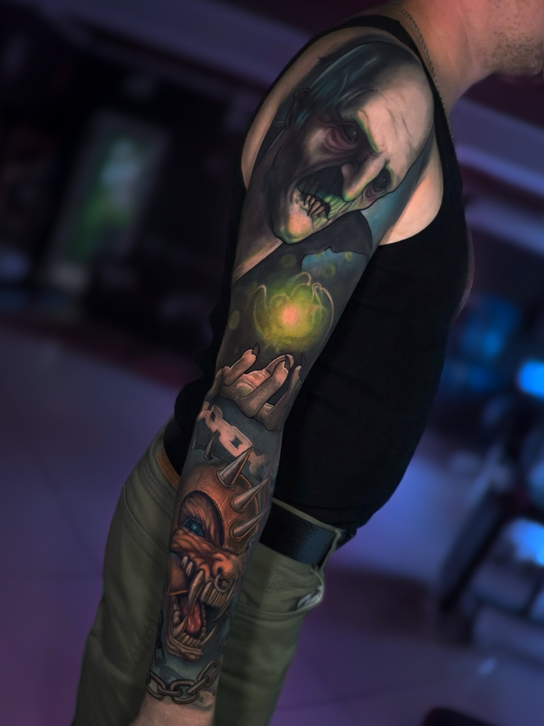 Large-scale colour realism sleeve tattoo by Vladimir Vishar