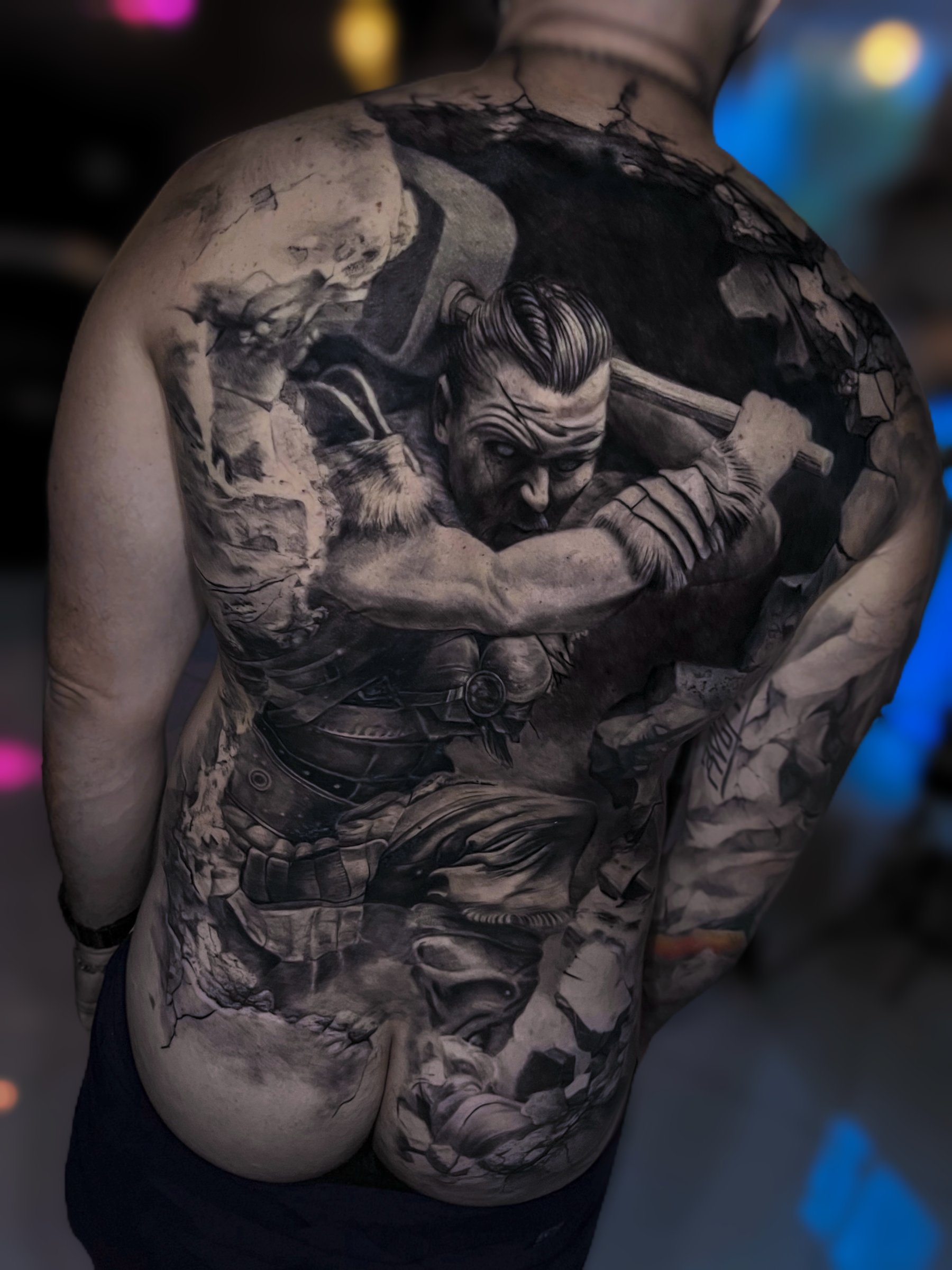Large-scale black and grey realism back piece by Vladimir Vishar