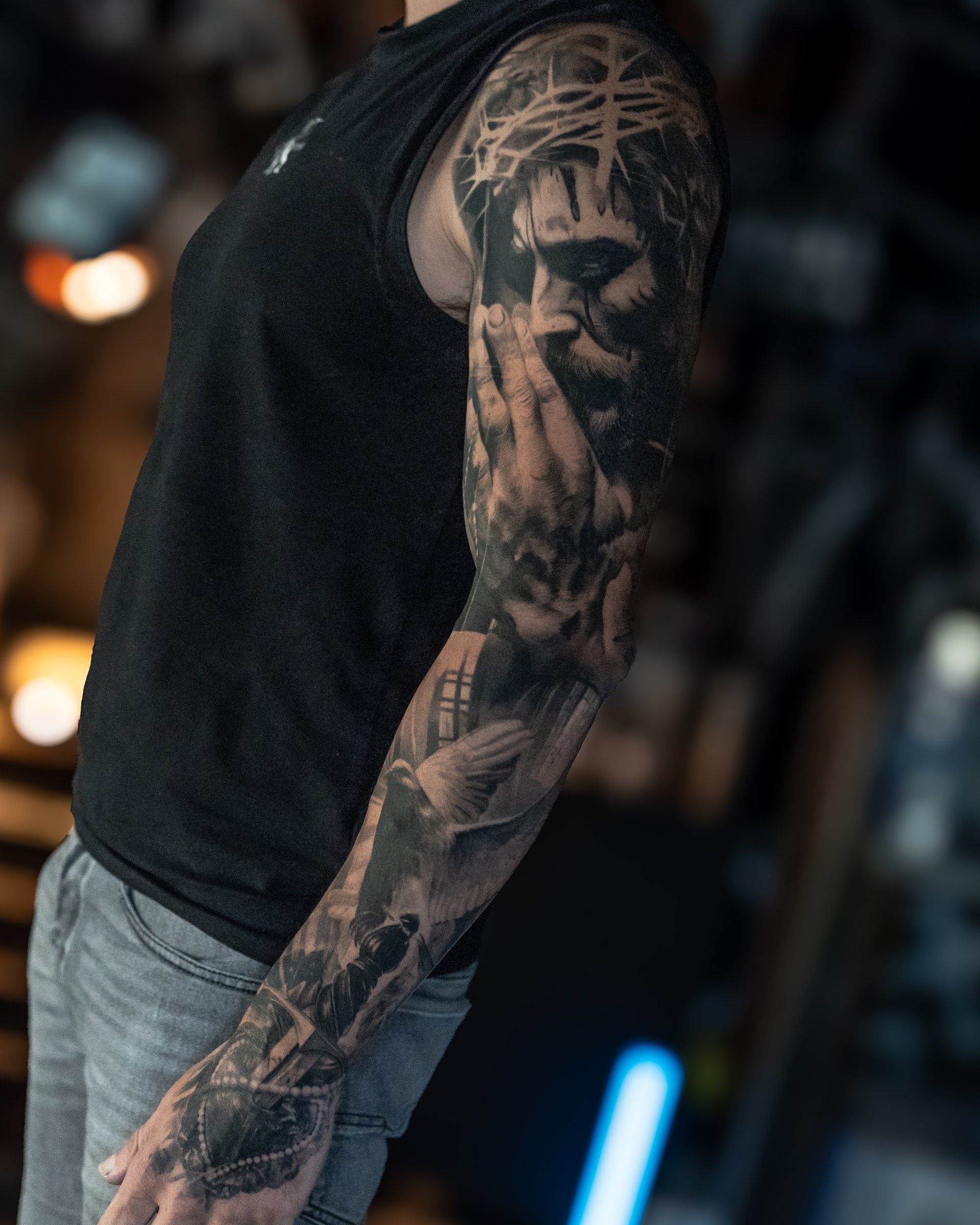 Large-scale black and grey realism sleeve tattoo by Vladimir Vishar