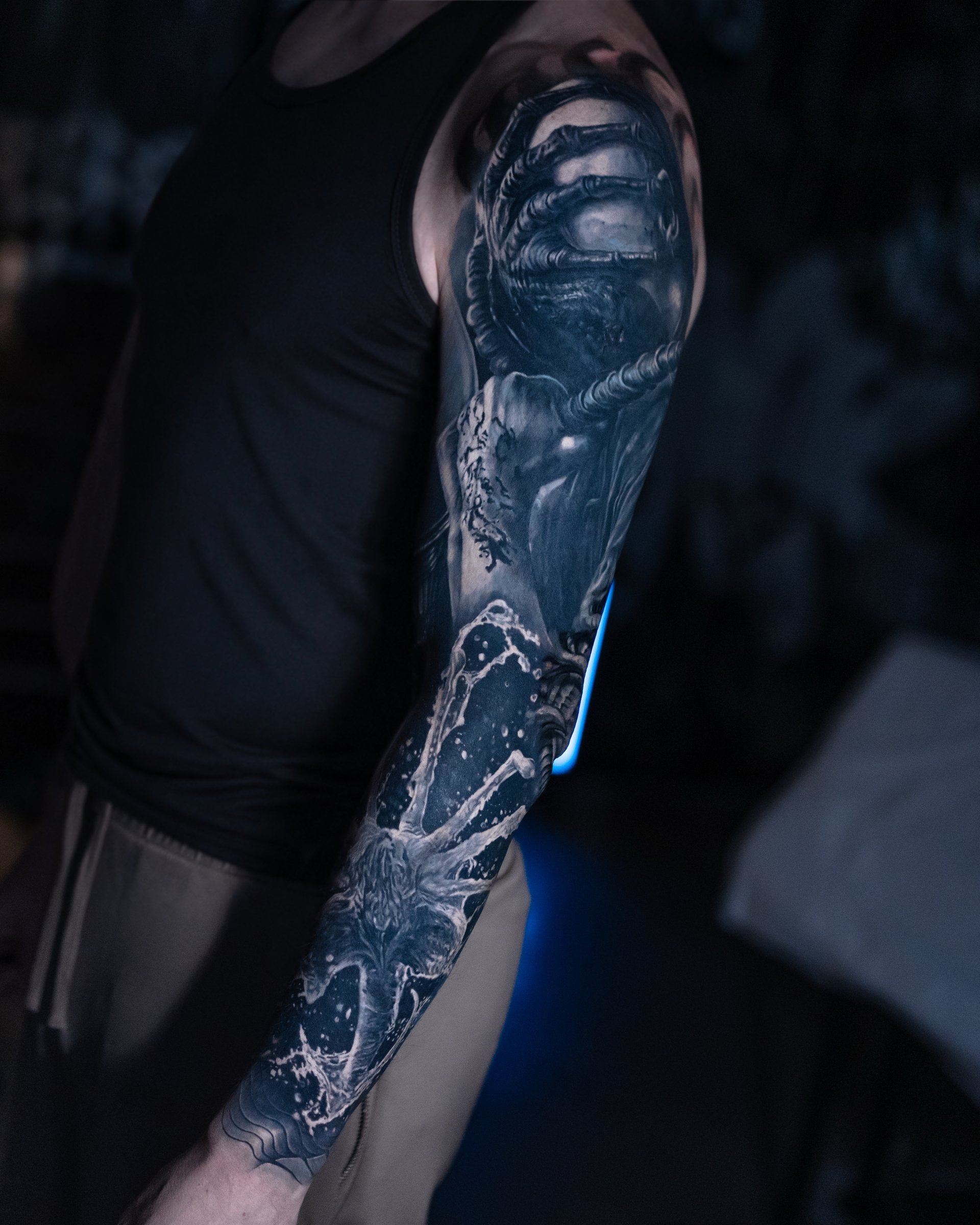 Large-scale black and grey realism arm sleeve by Vladimir Vishar