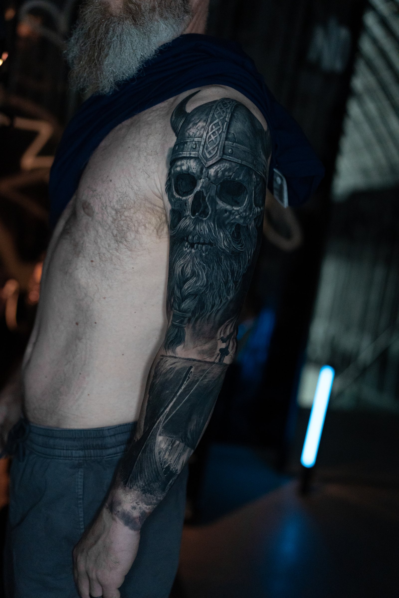 Black and grey realism upper-arm tattoo by Vladimir Vishar