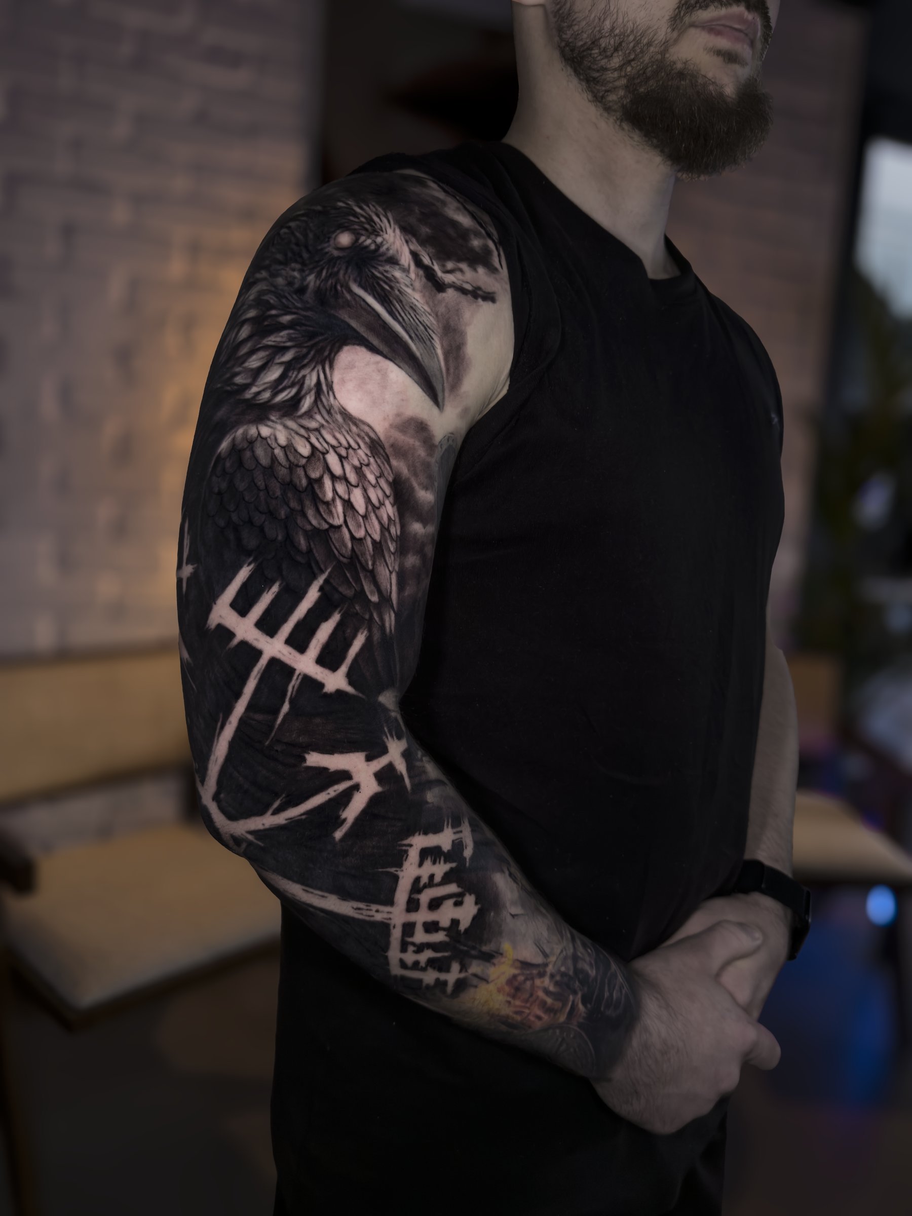 Large-scale black and grey realism sleeve with geometric elements by Vladimir Vishar