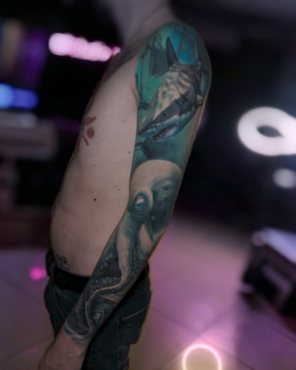 Large-scale colour realism arm tattoo by Vladimir Vishar