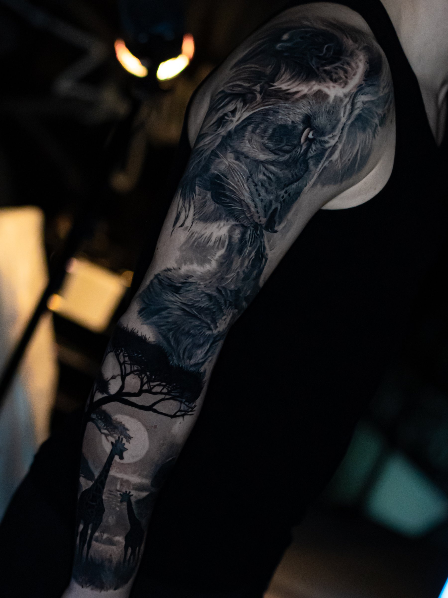 Large-scale black and grey realism upper-arm tattoo by Vladimir Vishar
