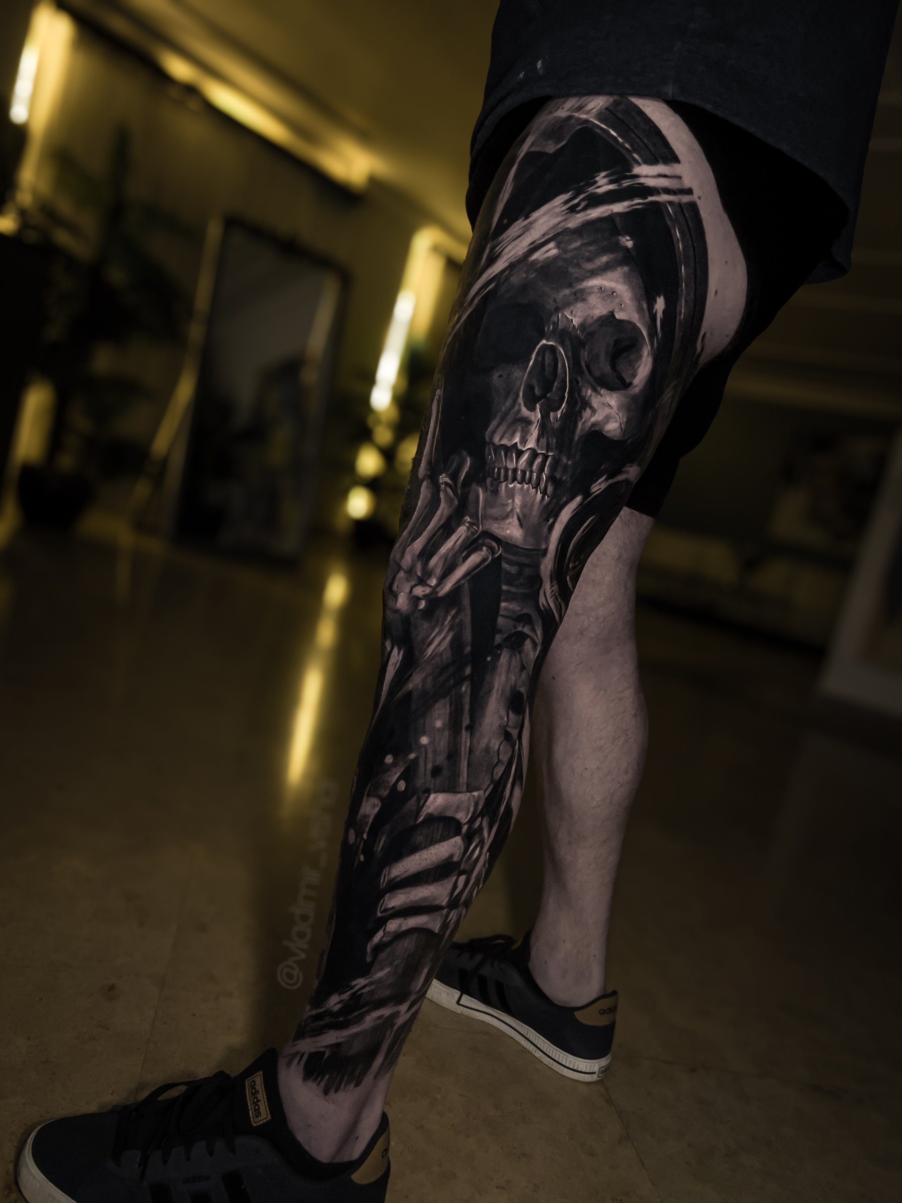 Large-scale black and grey realism leg tattoo by Vladimir Vishar
