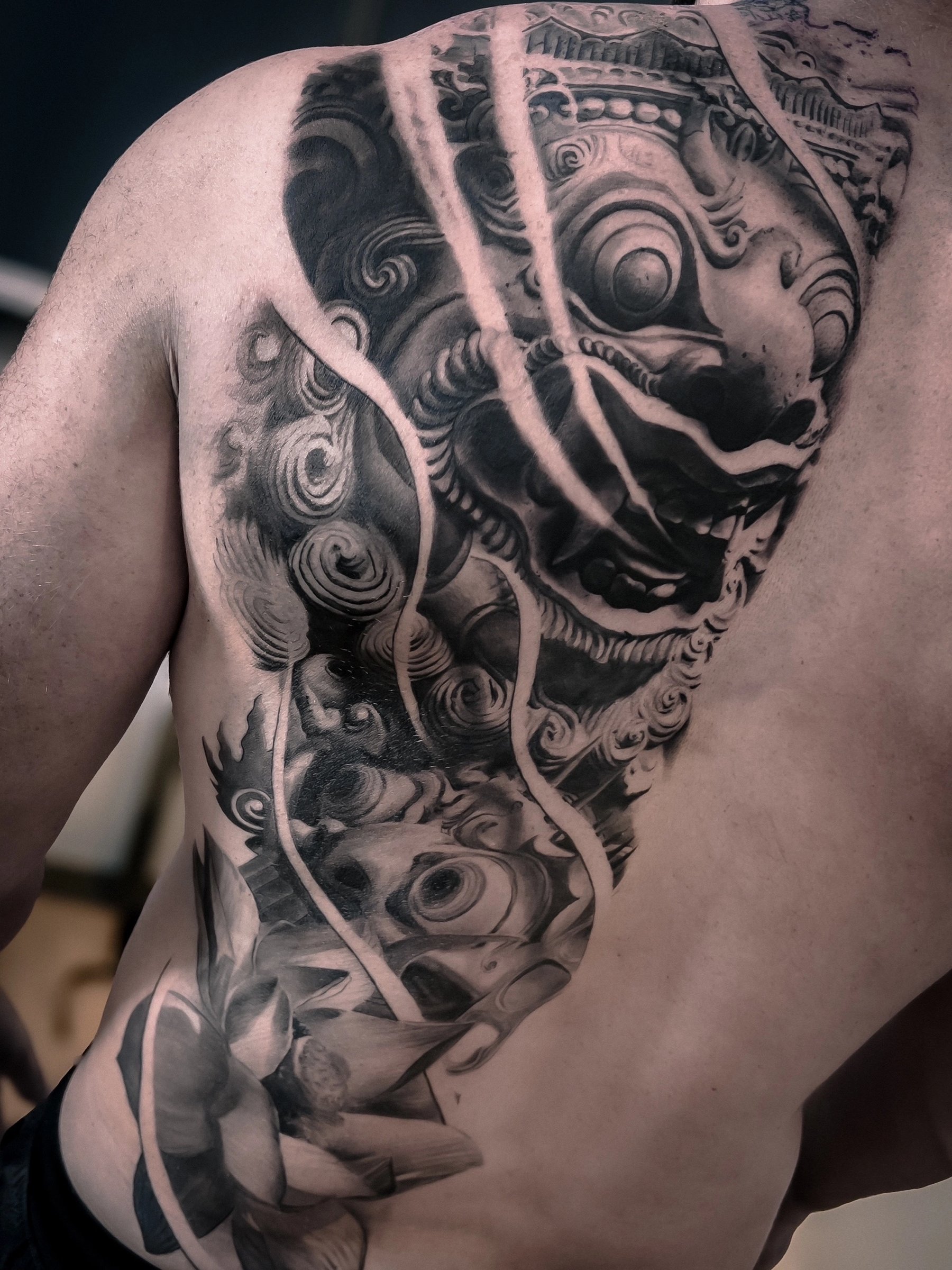 Large-scale black and grey realism torso and shoulder tattoo by Vladimir Vishar