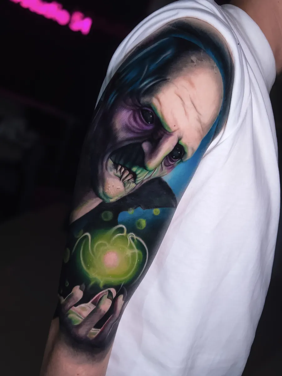Colour realism hooded portrait tattoo by Vladimir Vishar