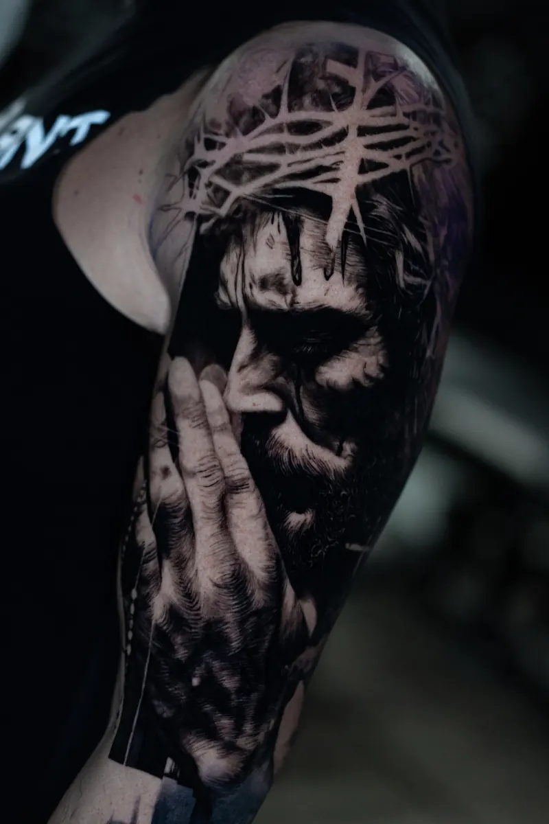 Black and grey realism expressive portrait tattoo by Vladimir Vishar