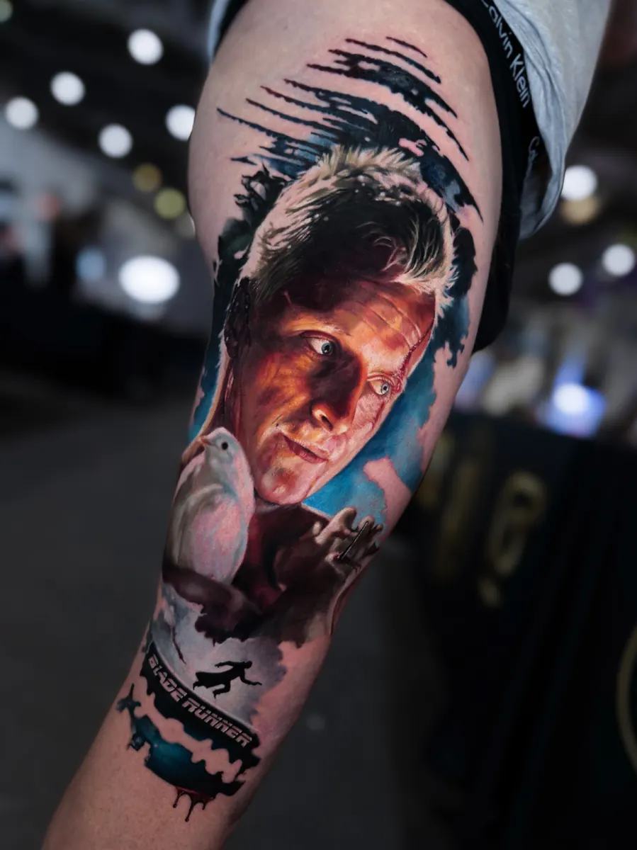 Colour realism male portrait tattoo with abstract brush details by Vladimir Vishar