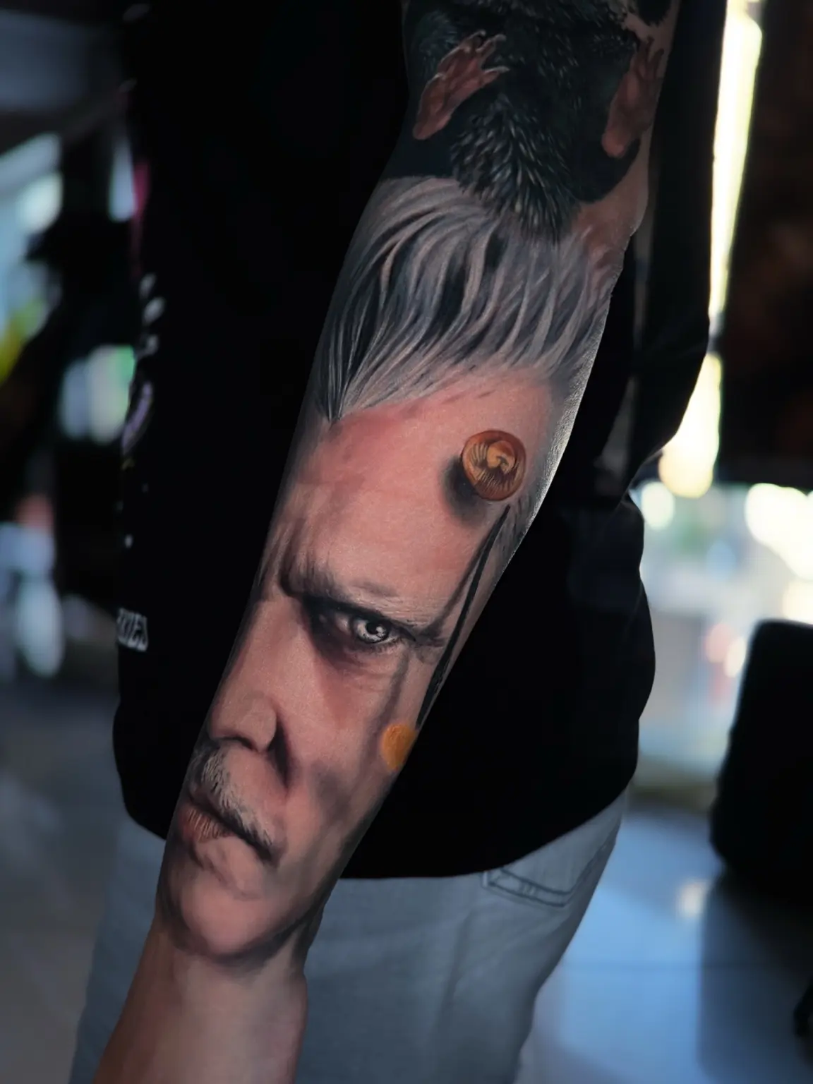 Colour realism male portrait tattoo with blue eye and warm accent by Vladimir Vishar
