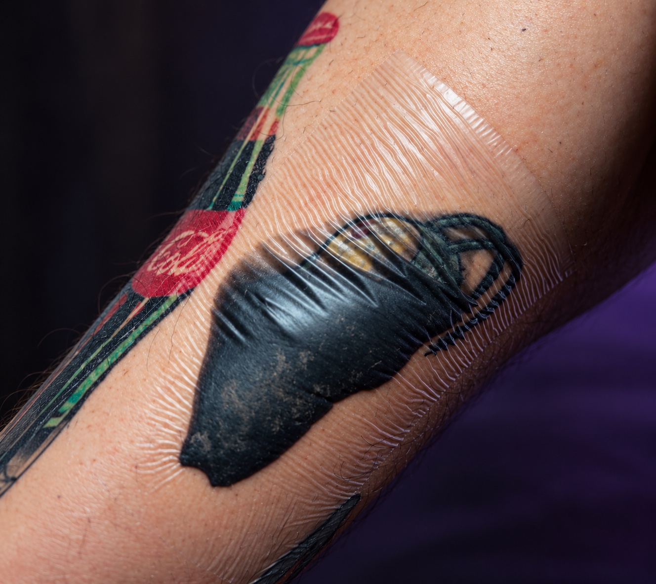 Tattoo covered with healing film